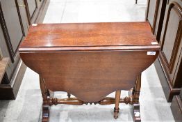 A small reproduction mahogany Sutherland type table 52cm x 61cm
