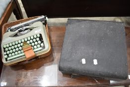 A vintage Hermes 'Baby' typewriter, sold together with a Imperial typewriter