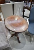 A 19th Century mahogany oval occasional table having turned column and triple splay legs