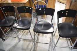 A set of four chrome and plastic kitchen bar stools