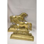 A pair of Victorian mirrored door stops in the form of horses cast in brass