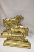 A pair of Victorian mirrored door stops in the form of horses cast in brass