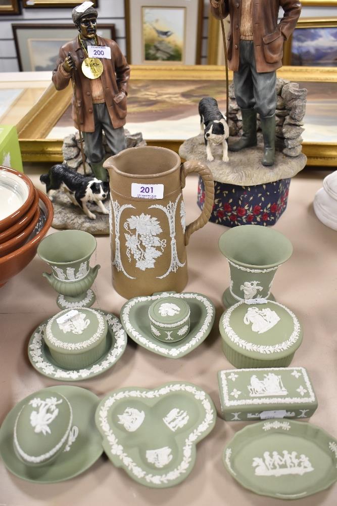 A collection of Wedgwood Jasperware in sage green with a Victorian brown ground jug of similar