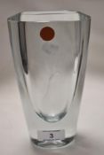 A modern art glass vase having an engraved Phoenix design on heavy set aqua glass. Signed