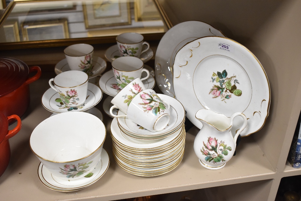 A Victorian porcelain part tea service having floral print pattern with enamel detailing