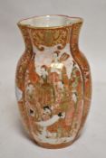 An antique Japanese Kutani ware porcelain vase having shaped form with two hand decorated panels