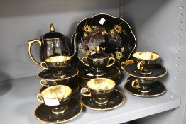 A Norsk Egersund Norway part tea service in a black and gilt glaze