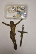 A selection of Catholic or Church of England crucifix necklaces and two lager metal crucifix