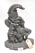A genuine Victorian cast iron door stop in the form of Mr. Punch