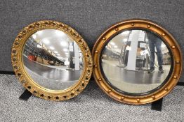 Two early 20th century convex glass mirrors one with a port hole design and similar with foliage
