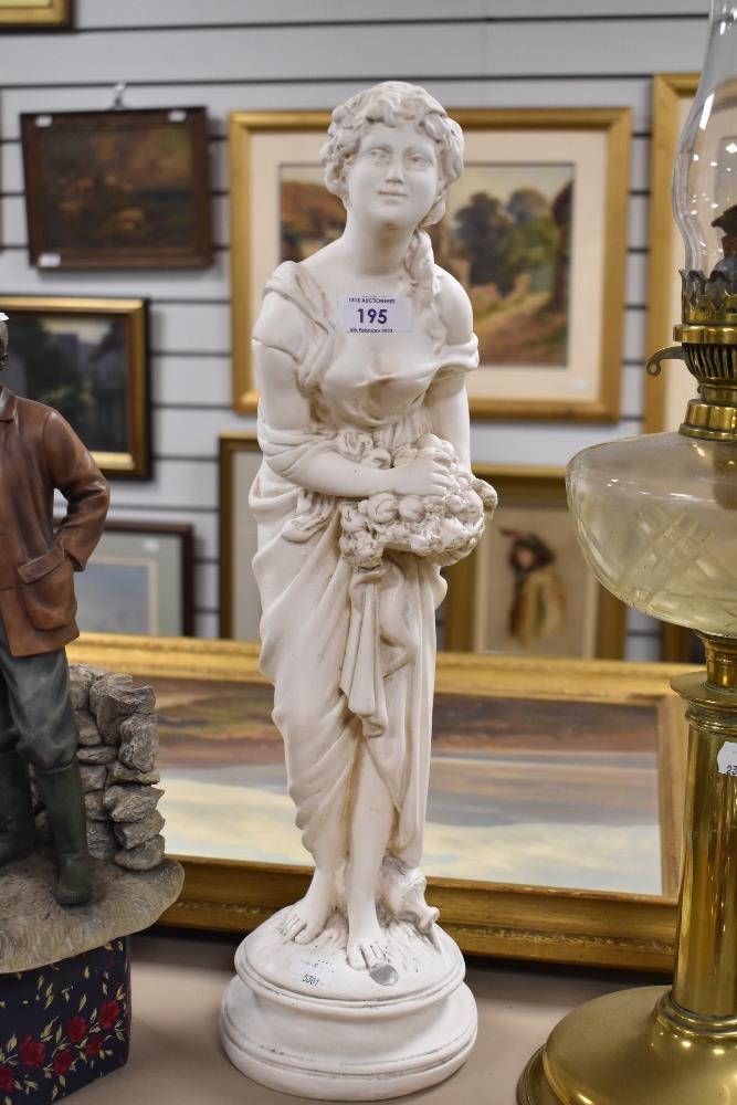 A vintage chalk ware statue figure of a Greek maiden.