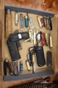 A collection of pocket and pen knives including a large Opinel, Swiss Army and Khyber.