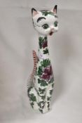 A mid century ceramic figure of a cat decorated in a kitsch design stamped Italy to base 38cm tall