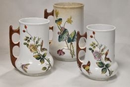 A set of Victorian graduated vases, decorated with butterfly's and foliage.