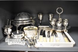 A fine selection of silver plated table wares including egg holder, revolving lid serving dish and