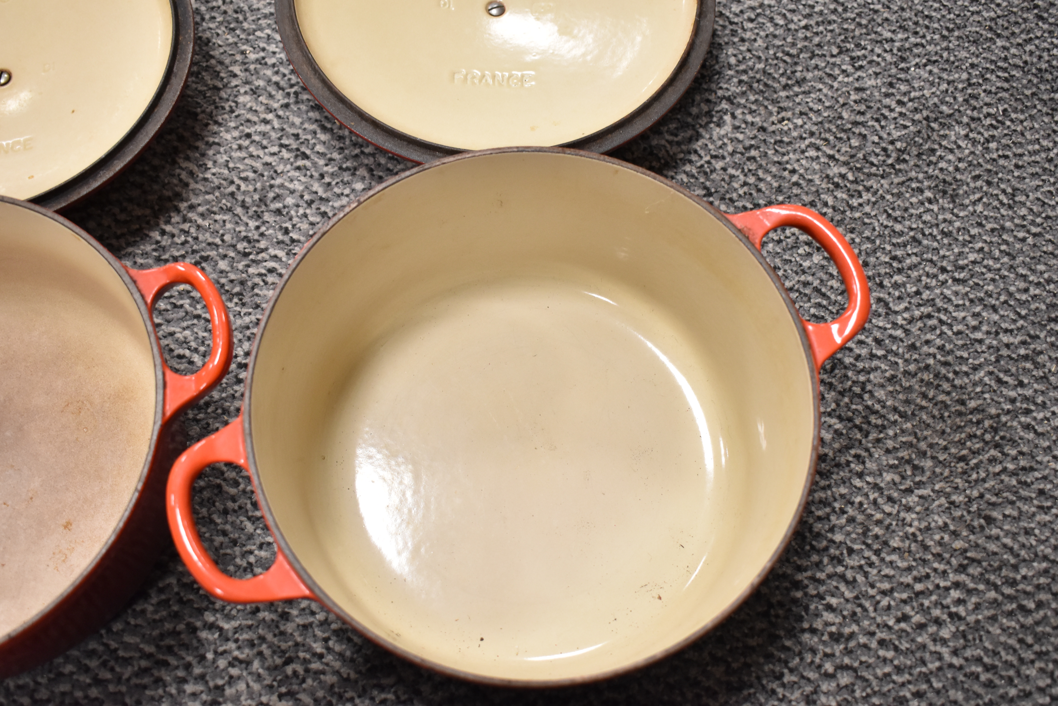 Two Le Creuset casserole dishes in red enamel, both used but in good condition. - Image 3 of 3