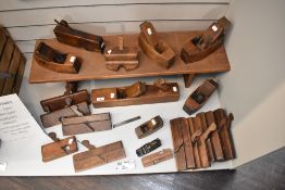 A selection of early 20th century joinery planes and wood working tools including jack plane,