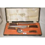 An early 20th century Lewis Rose carving knife set with horn handles.