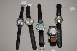 Five modern mens wrist watches all having black straps