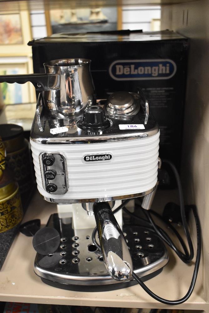 A modern Delonghi Espresso Cappuccino and coffee machine with box.