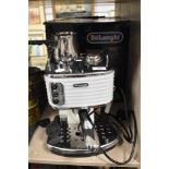 A modern Delonghi Espresso Cappuccino and coffee machine with box.