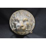 An antique bronze cast lion mask door knocker missing it's weight.