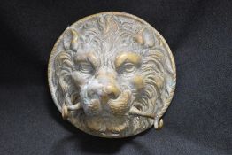 An antique bronze cast lion mask door knocker missing it's weight.