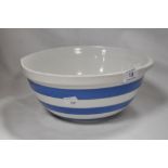 An early 20th century TG Green kitchen mixing bowl in blue and white with green back stamp.