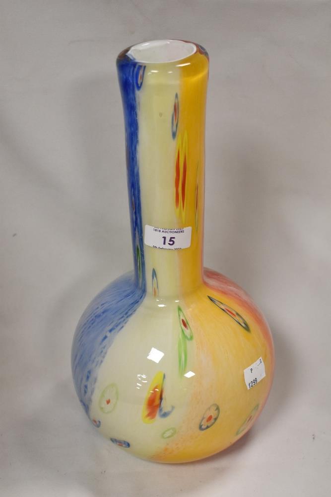 A modern art glass vase of bottle form possibly by Murano having five colour base with rod work