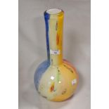 A modern art glass vase of bottle form possibly by Murano having five colour base with rod work