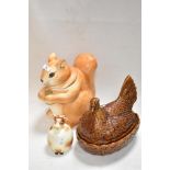 Three novelty kitchen jars including Portmeirion egg nest, Goebels cow jar and a Squirrel form jar