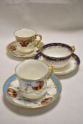 Three early 20th century tea cup and saucers sets being hand decorated by W. Lambert, blue tea cup