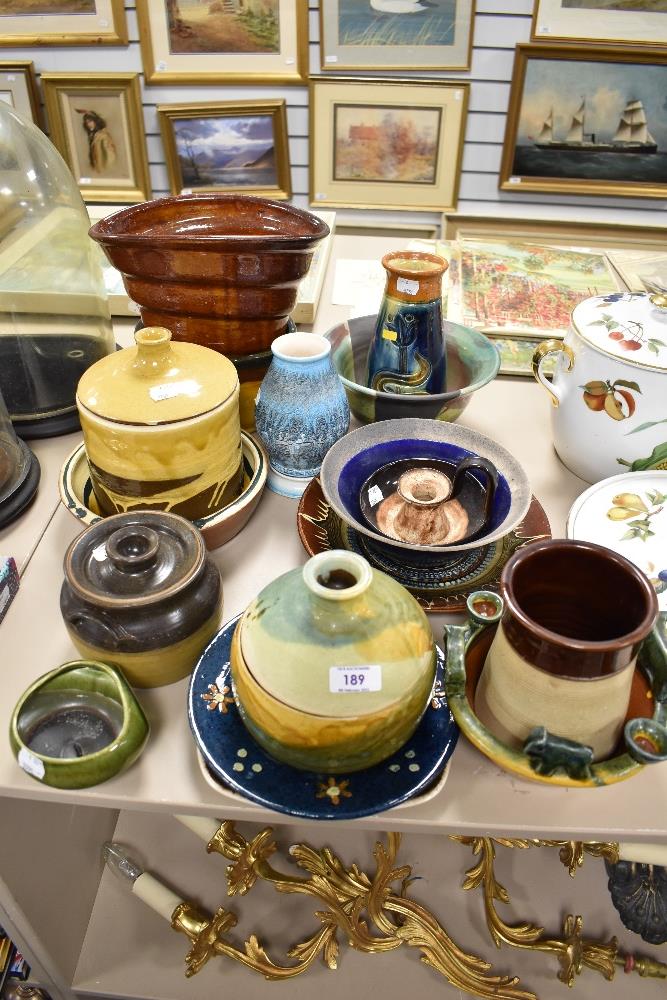 A good selection of studio pottery kitchen wares, including storage jars, vase, plates and bowls.