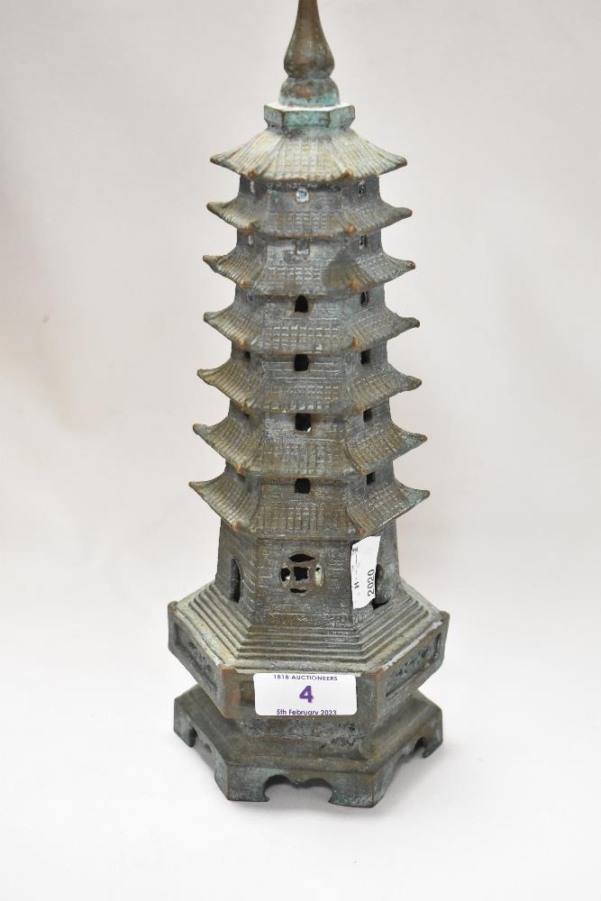 An antique bronze cast censor in the form of a Chinese pagoda, possibly early 18th century. 30cm