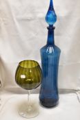 A large mid century Venetian style blue glass bottle and an over sized wine glass