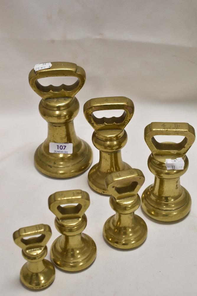 A fine set of graduated brass kitchen weights