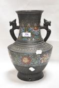 A modern Chinese vase or converted lamp base cast bronze in archaic form with cloisonne decoration.