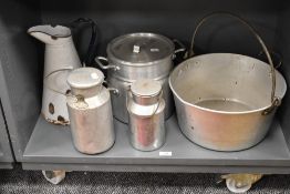 Two aluminium dairy cans with a jam pan, water jug and steaming pan.