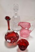 Four pieces of ruby or cranberry glass wares and a angel form decanter.