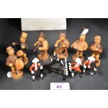 A miniature wooden hand made band of six figures with art glass classical trio made from lamp work