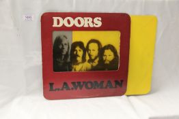 A nice UK Doors original LA Woman in the die-cut cellophane windo sleeve with rounded corners and
