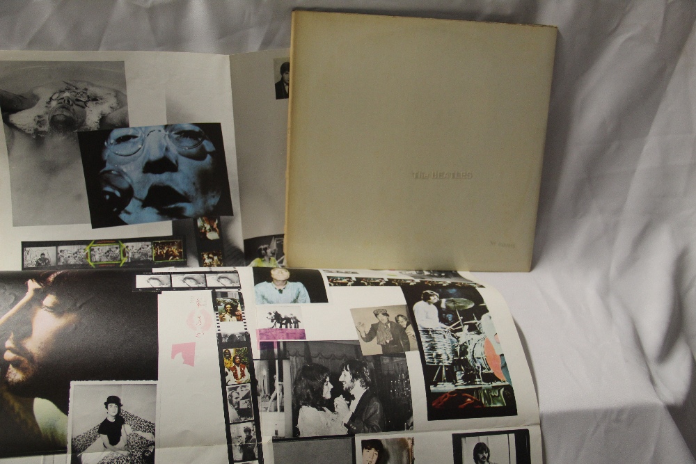 A top loading Beatles White album numbered 0334085, which comes with poster but no band inserts.