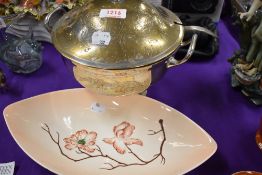 A silver plated tureen and ladle and a Carlton Ware oval dish.