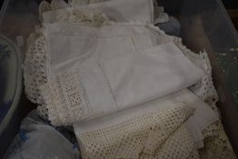A selection of linen and lace, doilies, bead work trim
