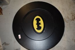 A wooden circular Bat Man Logo/Icon, diameter 52cm