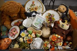 An eclectic mix of fuana ware, teddy bear, hand painted stones etc