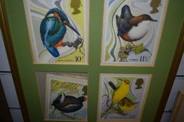 A set of four prints depicting bird in the form of large stamps