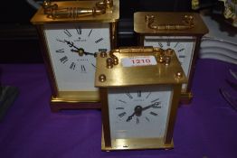Three modern brass cased carriage clocks including Junghans and two by Estyma