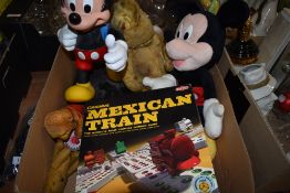 An assortment of vintage toys including Mickey Mouses in plush and plastic and a Tactic Mexican