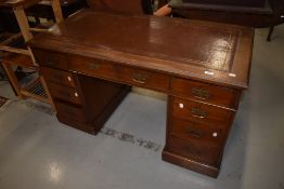 A 19th Century Aesthetic style mahogany pedestal desk